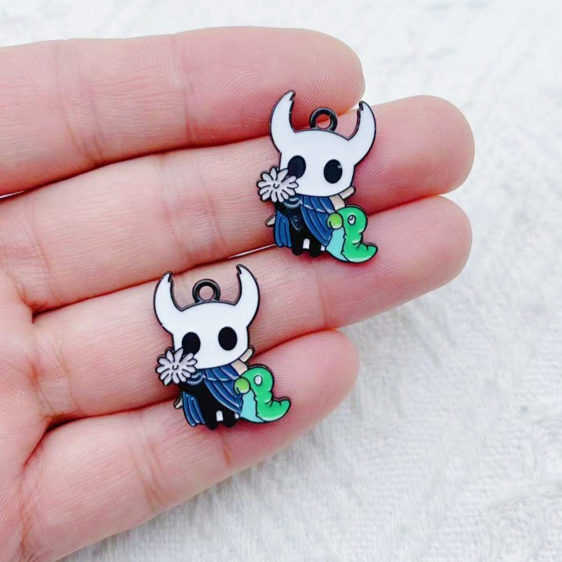 10 pendentifs en alliage motif - Party Games Questions avis et prix