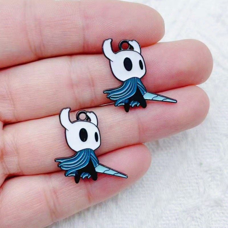 10 pendentifs en alliage motif - Party Games Questions avis et prix